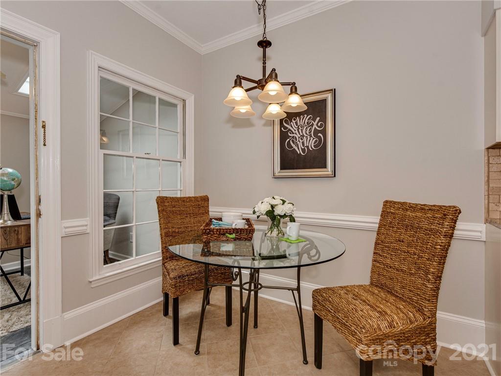 5939 Quail Hollow Road, Unit B Charlotte, NC 28210 - Photo 11 of 23 a view of a dining room with furniture and wooden floor