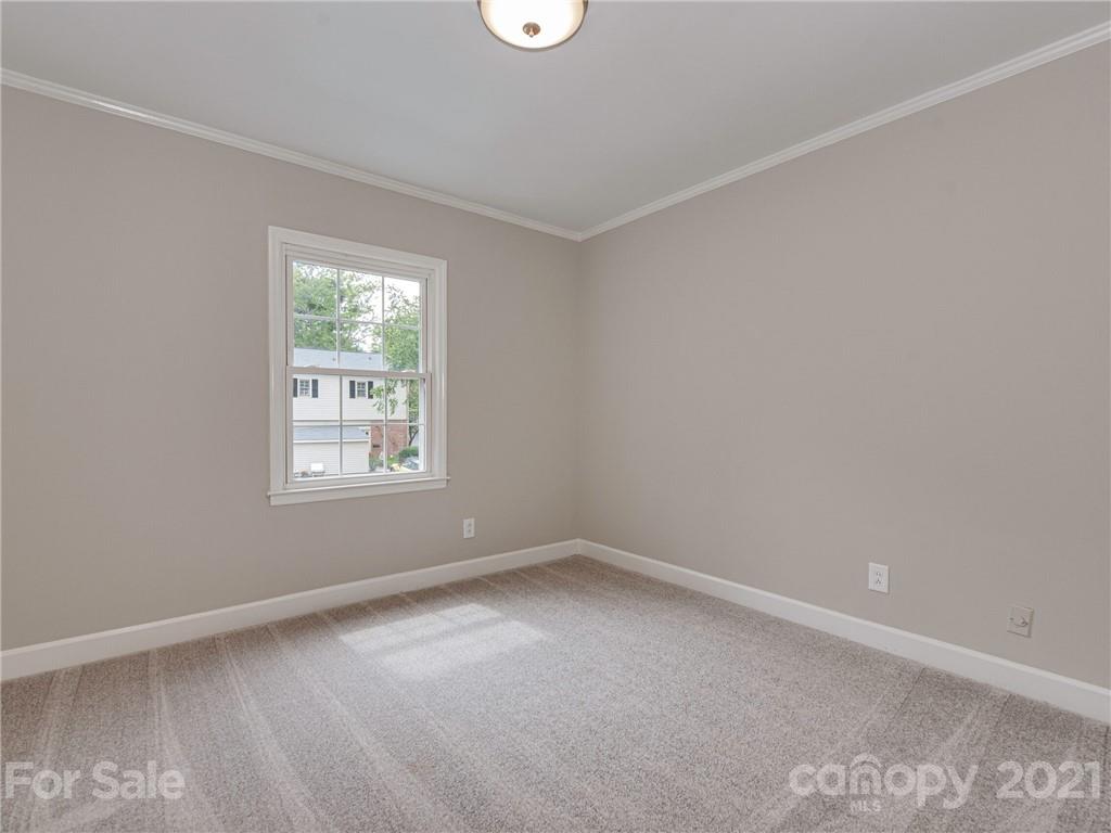 5939 Quail Hollow Road, Unit B Charlotte, NC 28210 - Photo 17 of 23 an empty room with a window