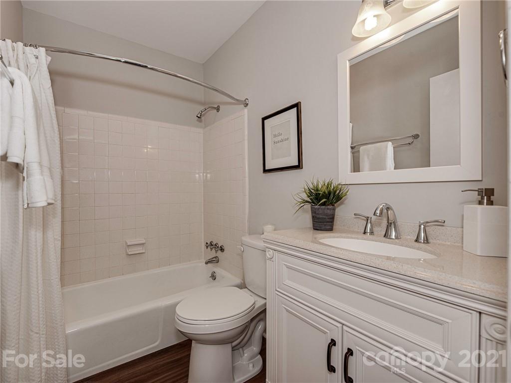 5939 Quail Hollow Road, Unit B Charlotte, NC 28210 - Photo 18 of 23 a bathroom with a sink a toilet and shower