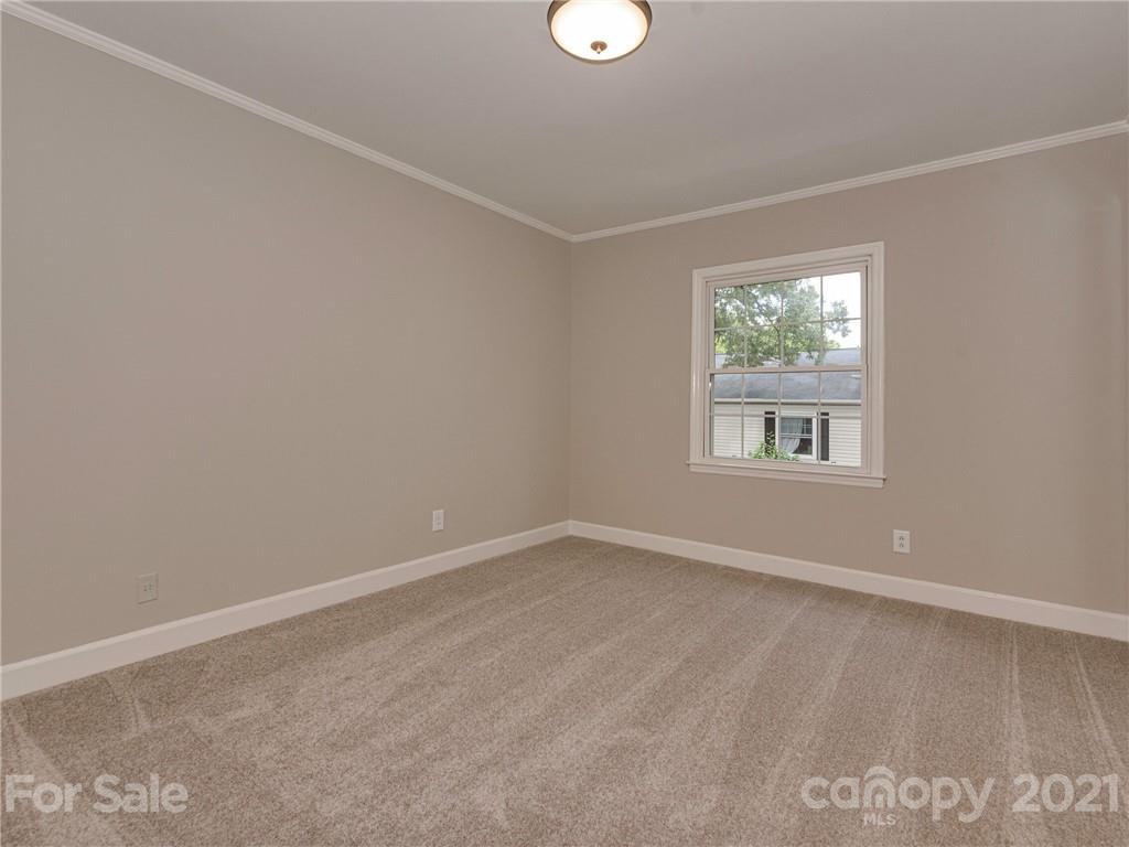5939 Quail Hollow Road, Unit B Charlotte, NC 28210 - Photo 19 of 23 an empty room with windows