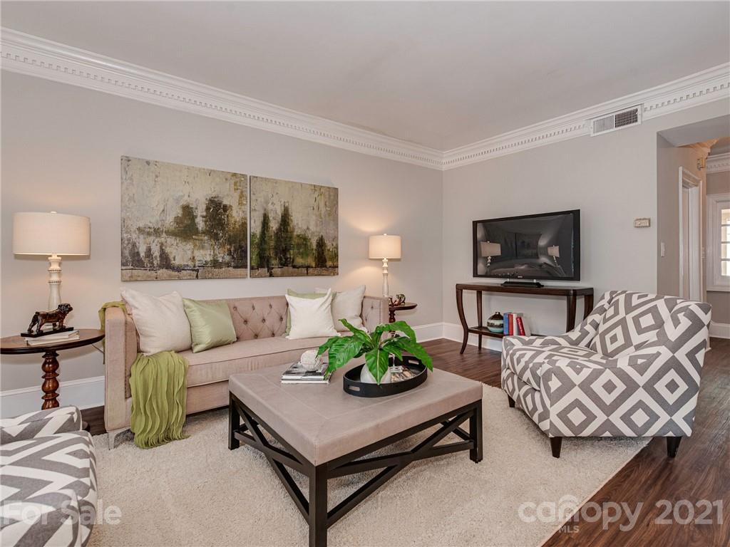 5939 Quail Hollow Road, Unit B Charlotte, NC 28210 - Photo 3 of 23 a living room with furniture and a flat screen tv