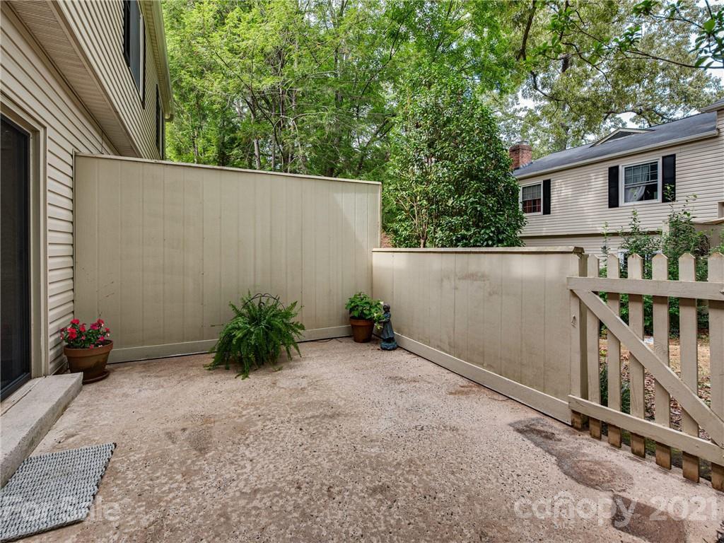 5939 Quail Hollow Road, Unit B Charlotte, NC 28210 - Photo 21 of 23 a backyard of a house with lots of green space and fountain