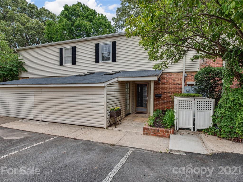 5939 Quail Hollow Road, Unit B Charlotte, NC 28210 - Photo 23 of 23 a view of a house with a yard and garage