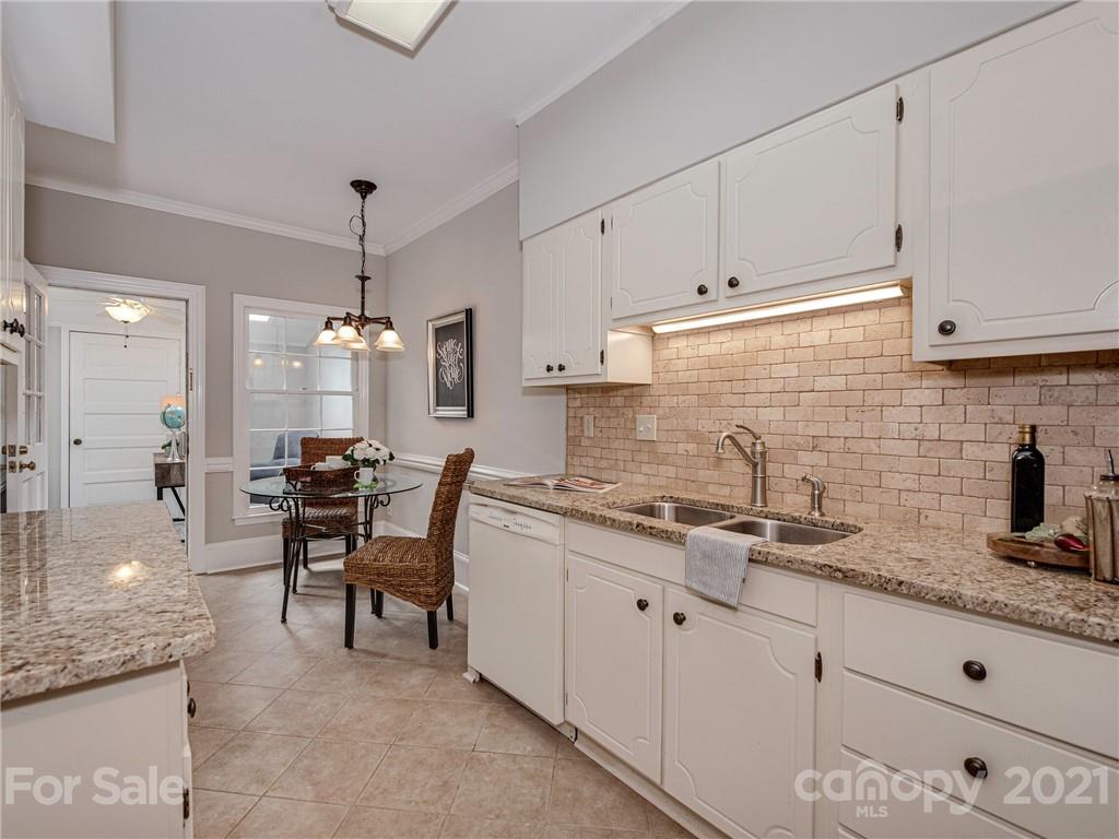 5939 Quail Hollow Road, Unit B Charlotte, NC 28210 - Photo 7 of 23 a kitchen with sink cabinets and stove