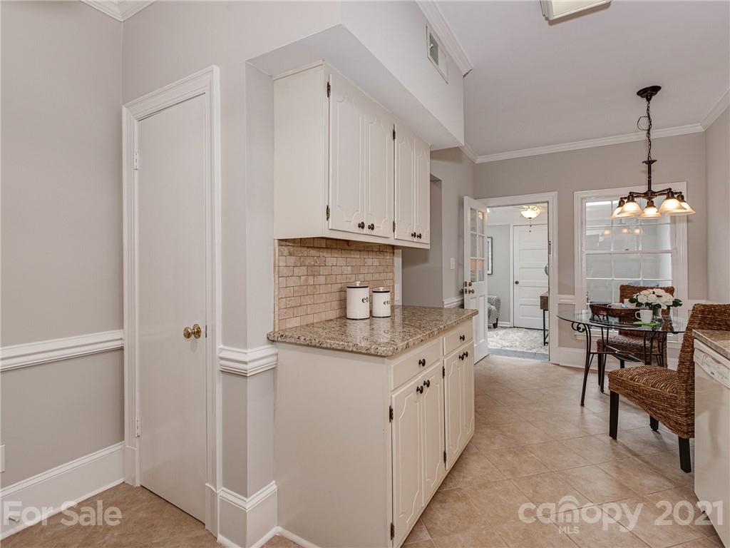 5939 Quail Hollow Road, Unit B Charlotte, NC 28210 - Photo 10 of 23 a kitchen with stainless steel appliances granite countertop a stove a sink and a refrigerator