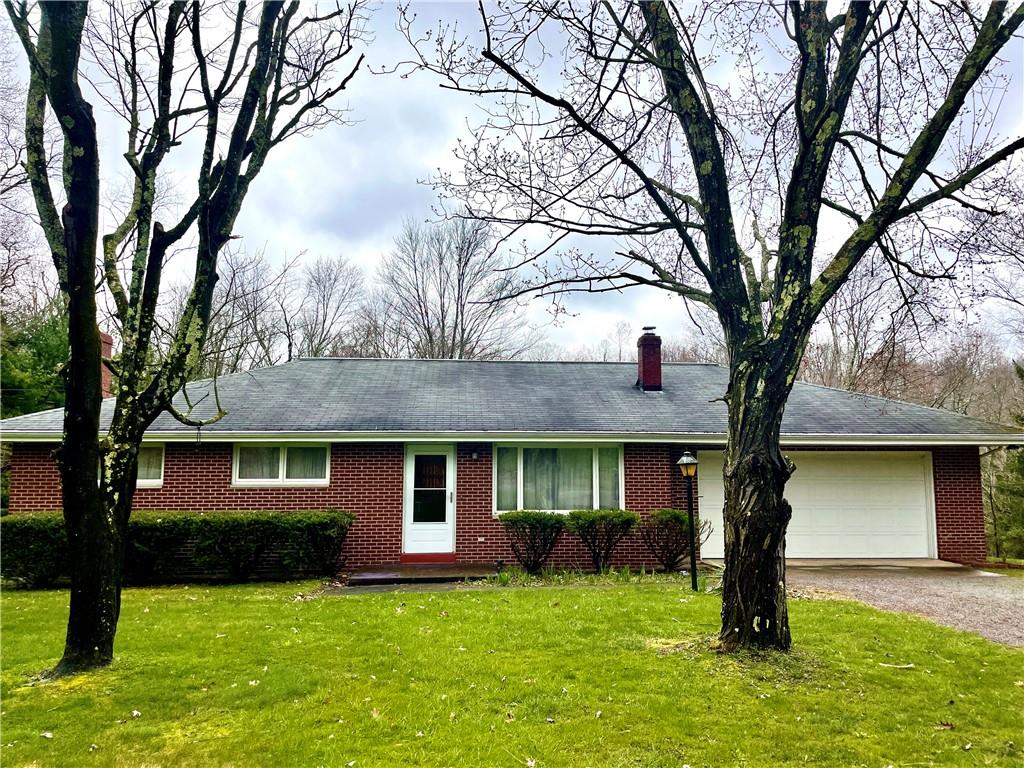 362 Carbon Center Road Butler, PA 16002 - Photo 1 of 43 a front view of a house with a garden