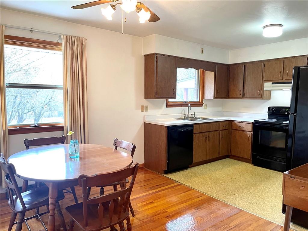 362 Carbon Center Road Butler, PA 16002 - Photo 12 of 43 a kitchen with a table chairs sink and cabinets