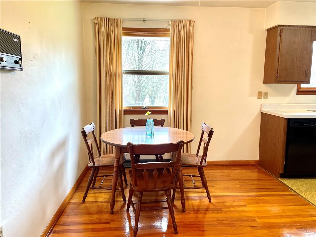 362 Carbon Center Road Butler, PA 16002 - Photo 13 of 43 a dining room with furniture and wooden floor