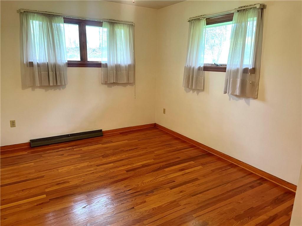 362 Carbon Center Road Butler, PA 16002 - Photo 17 of 43 a view of empty room with wooden floor and fan