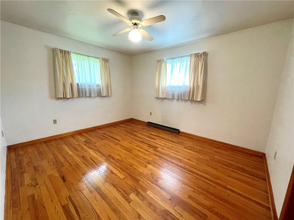362 Carbon Center Road Butler, PA 16002 - Photo 18 of 43 a view of empty room with wooden floor and fan