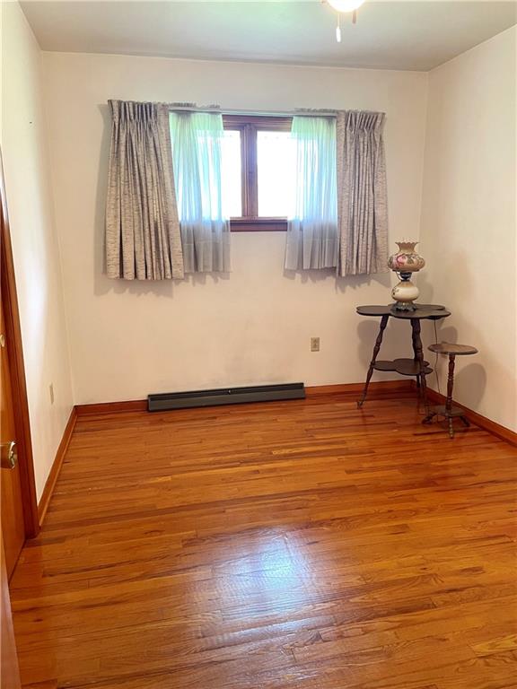 362 Carbon Center Road Butler, PA 16002 - Photo 20 of 43 a room with wooden floor and windows
