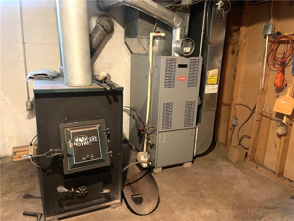 362 Carbon Center Road Butler, PA 16002 - Photo 31 of 43 a room with water heater and wooden walls