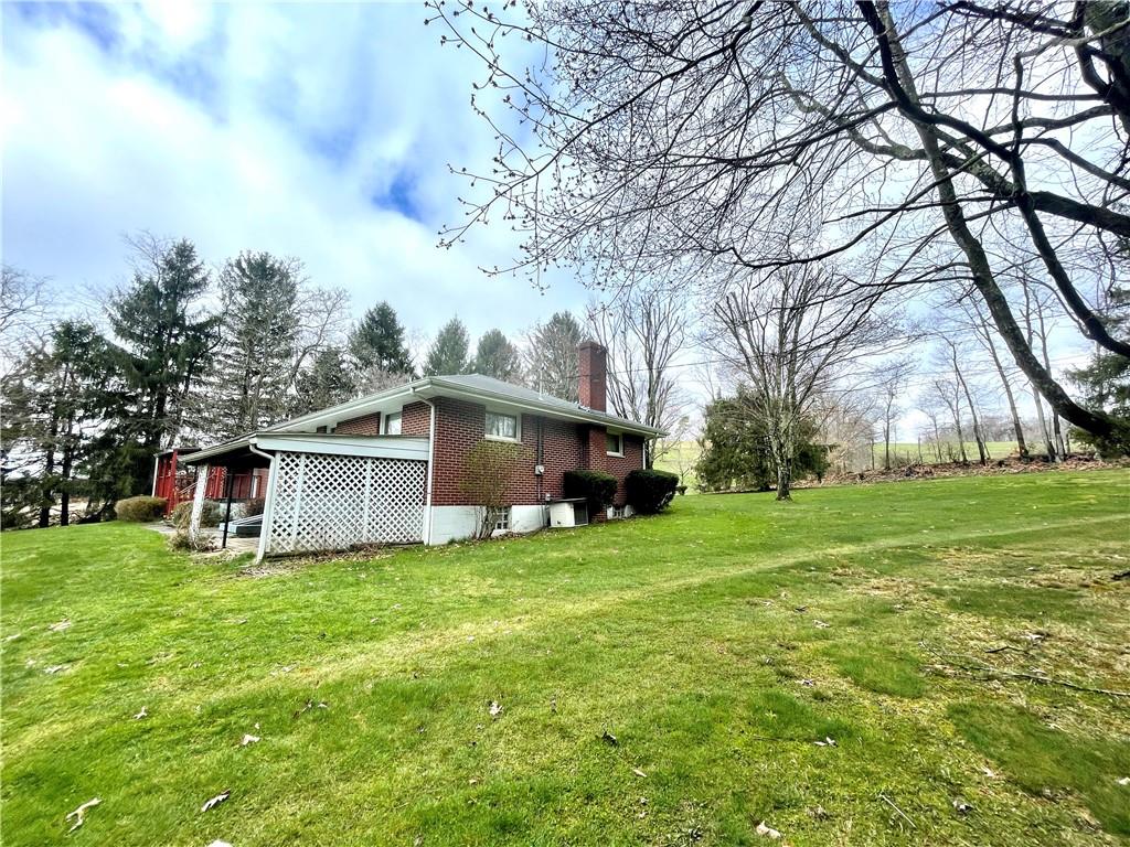 362 Carbon Center Road Butler, PA 16002 - Photo 35 of 43 a view of a house with a big yard and large trees