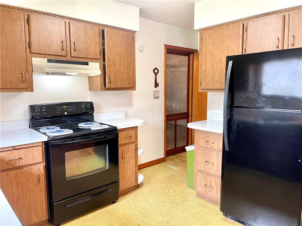 362 Carbon Center Road Butler, PA 16002 - Photo 6 of 43 a kitchen with stainless steel appliances granite countertop a refrigerator stove and cabinets