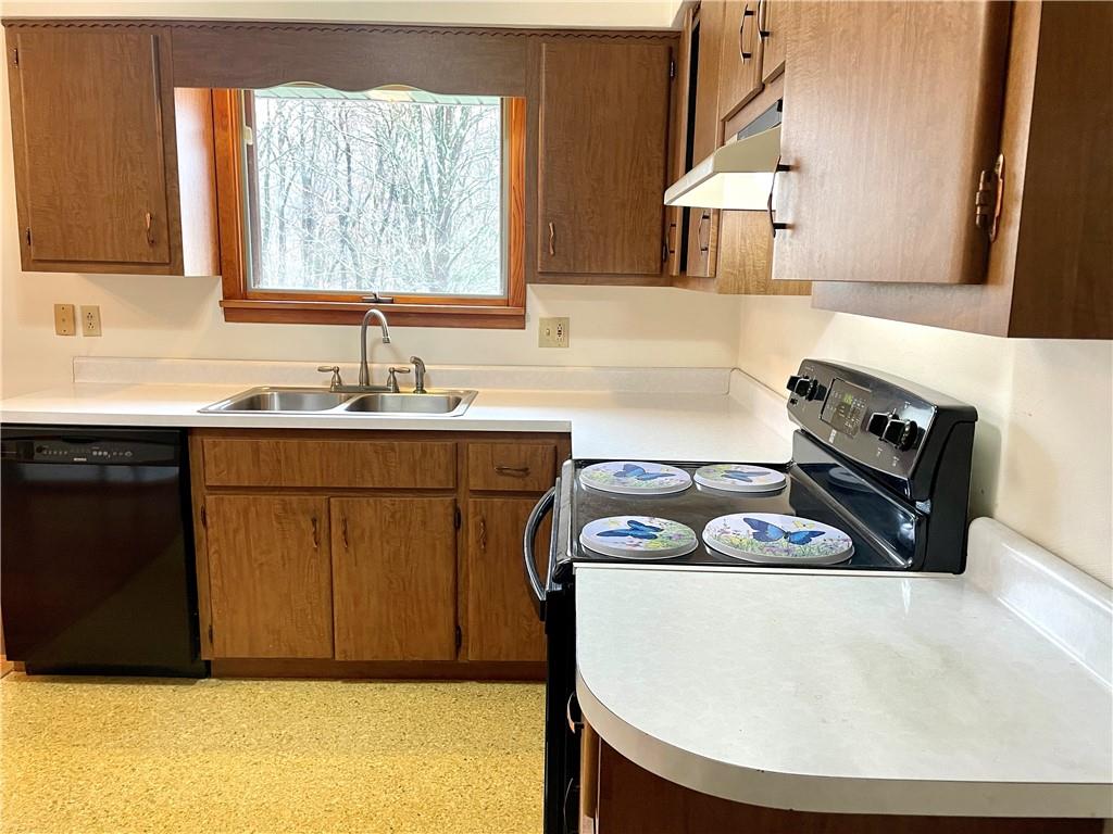 362 Carbon Center Road Butler, PA 16002 - Photo 8 of 43 a kitchen with a sink a stove and a microwave