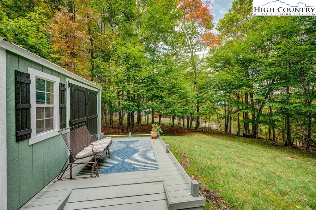 607 Charter Hills Road Beech Mountain, NC 28604 - Photo 28 of 31 a garden view with a seating space