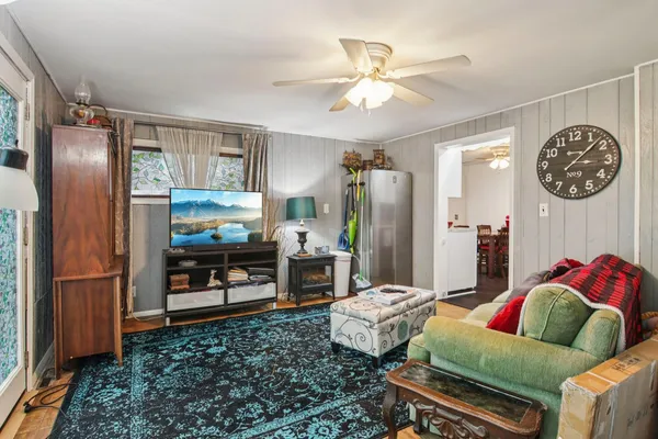 a living room with furniture and a table