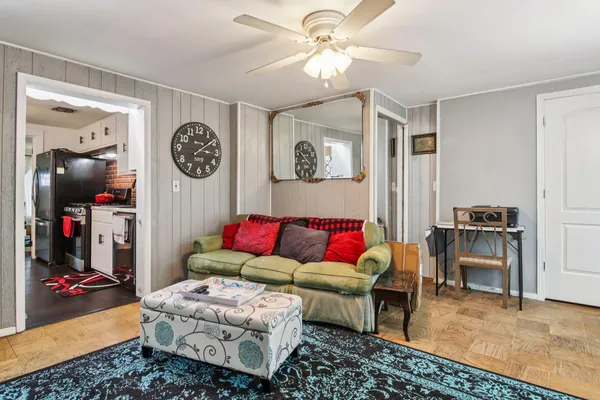 a living room with furniture and a table