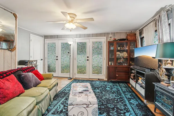 a living room with furniture and a fireplace