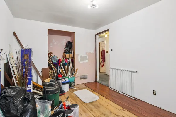 a bedroom with furniture and a gym equipment