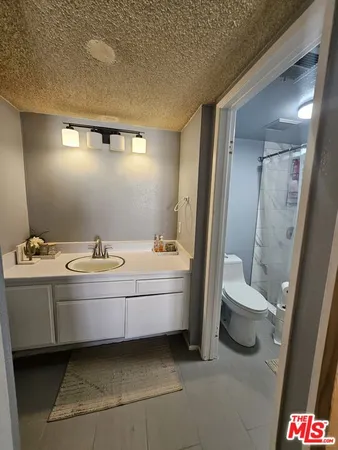 a spacious bathroom with a bathtub and toilet