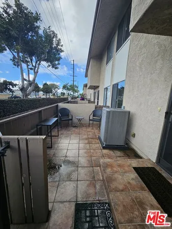 a view of roof deck with patio
