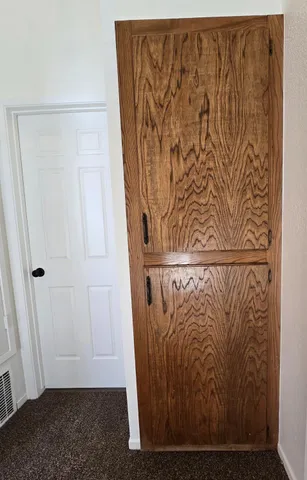 a view of door with wooden floor
