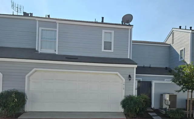 a front view of a house with garage