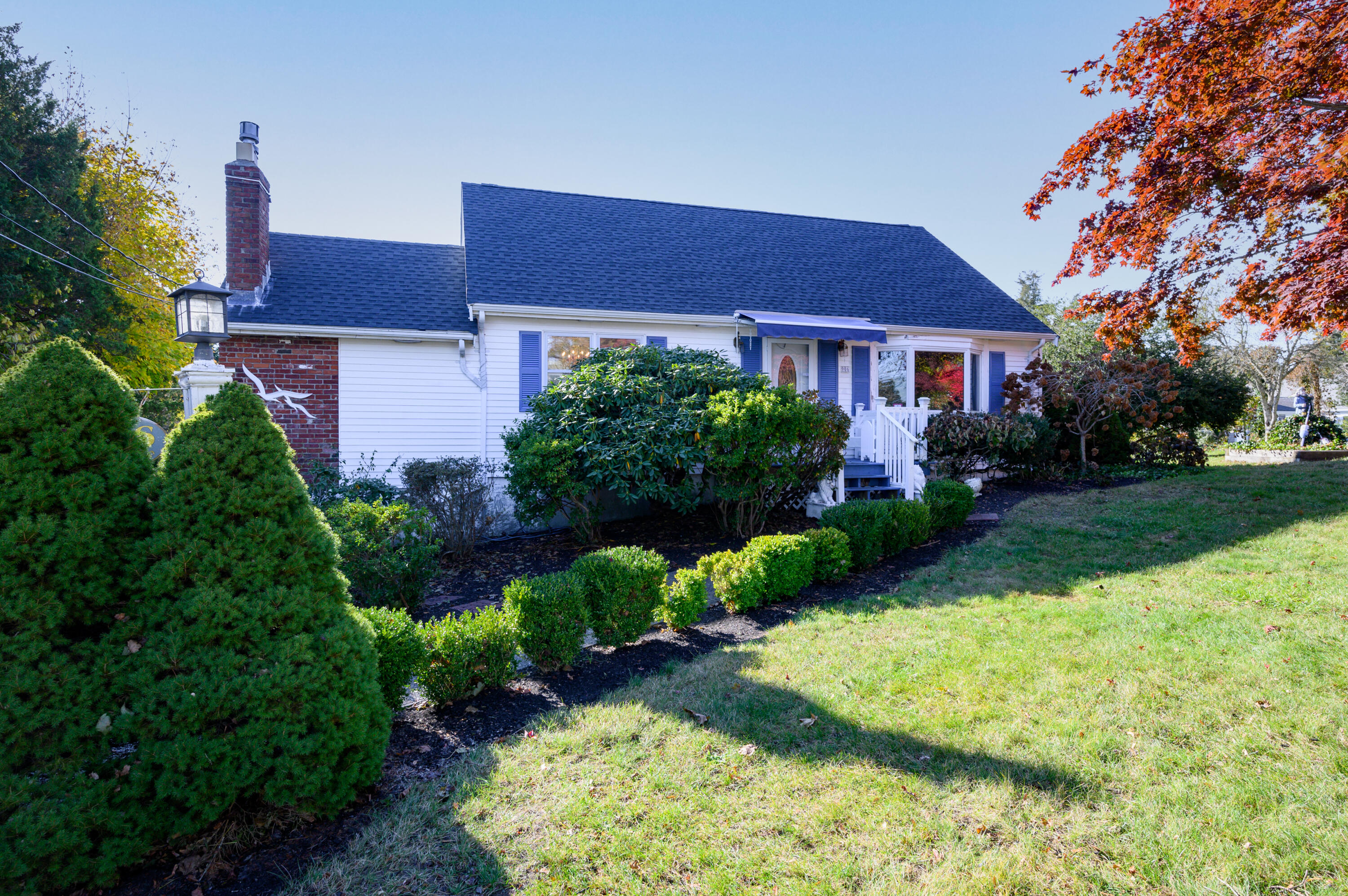 906 Shore Road Pocasset, MA 02559 - Photo 1 of 38 a view of a house with garden