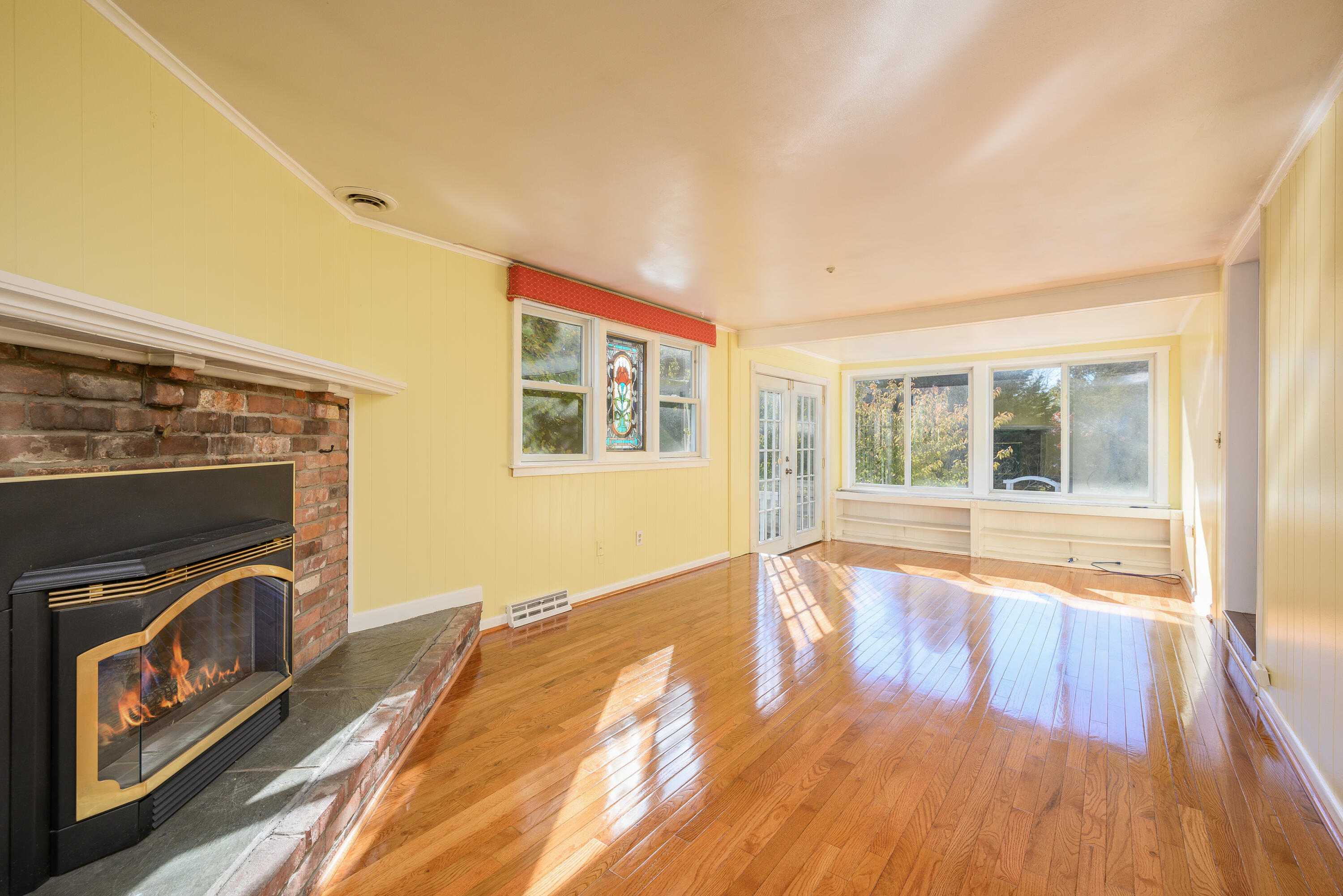 906 Shore Road Pocasset, MA 02559 - Photo 11 of 38 a view of an empty room with wooden floor and a window