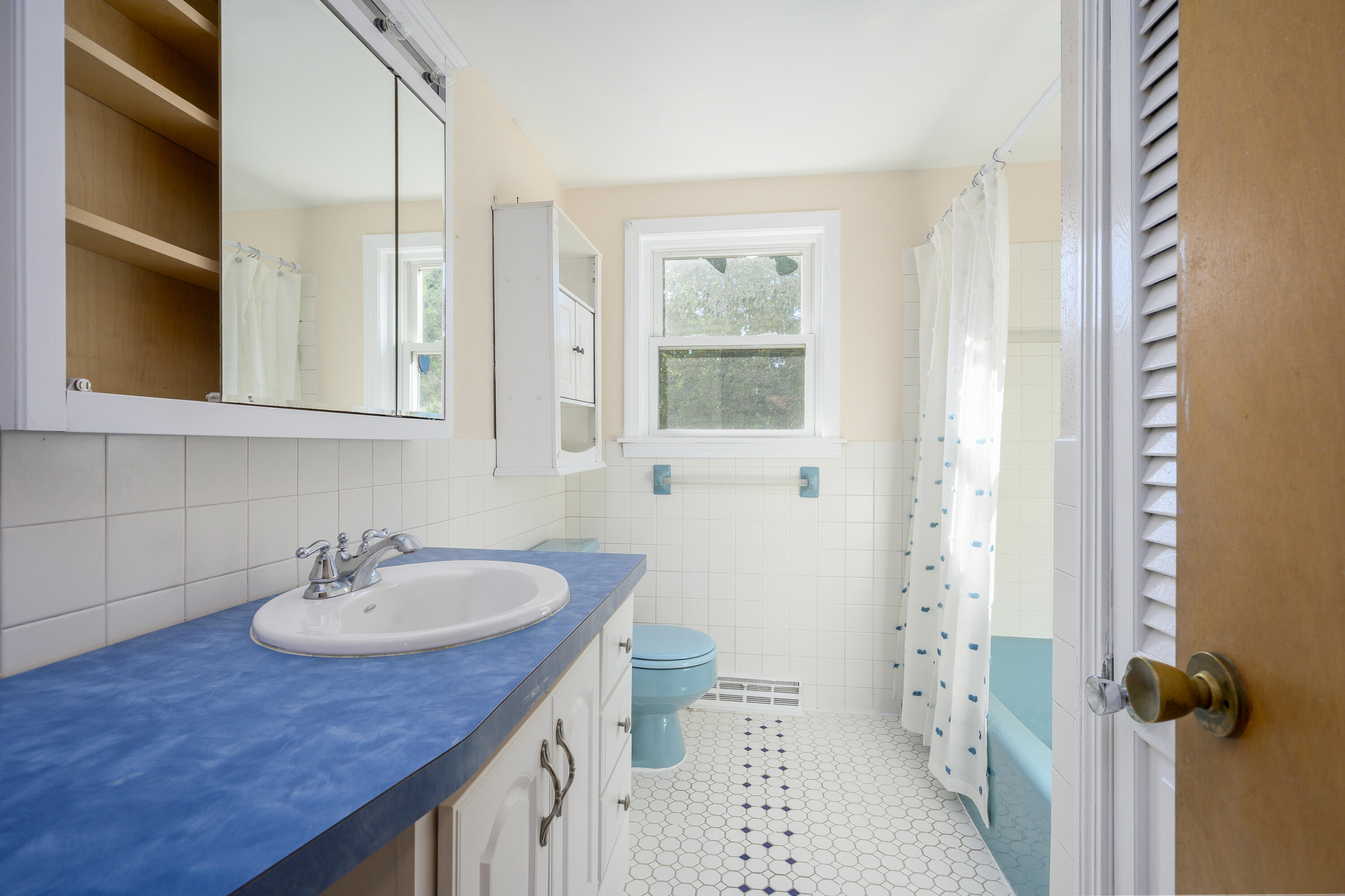 906 Shore Road Pocasset, MA 02559 - Photo 12 of 38 a bathroom with a sink and a toilet