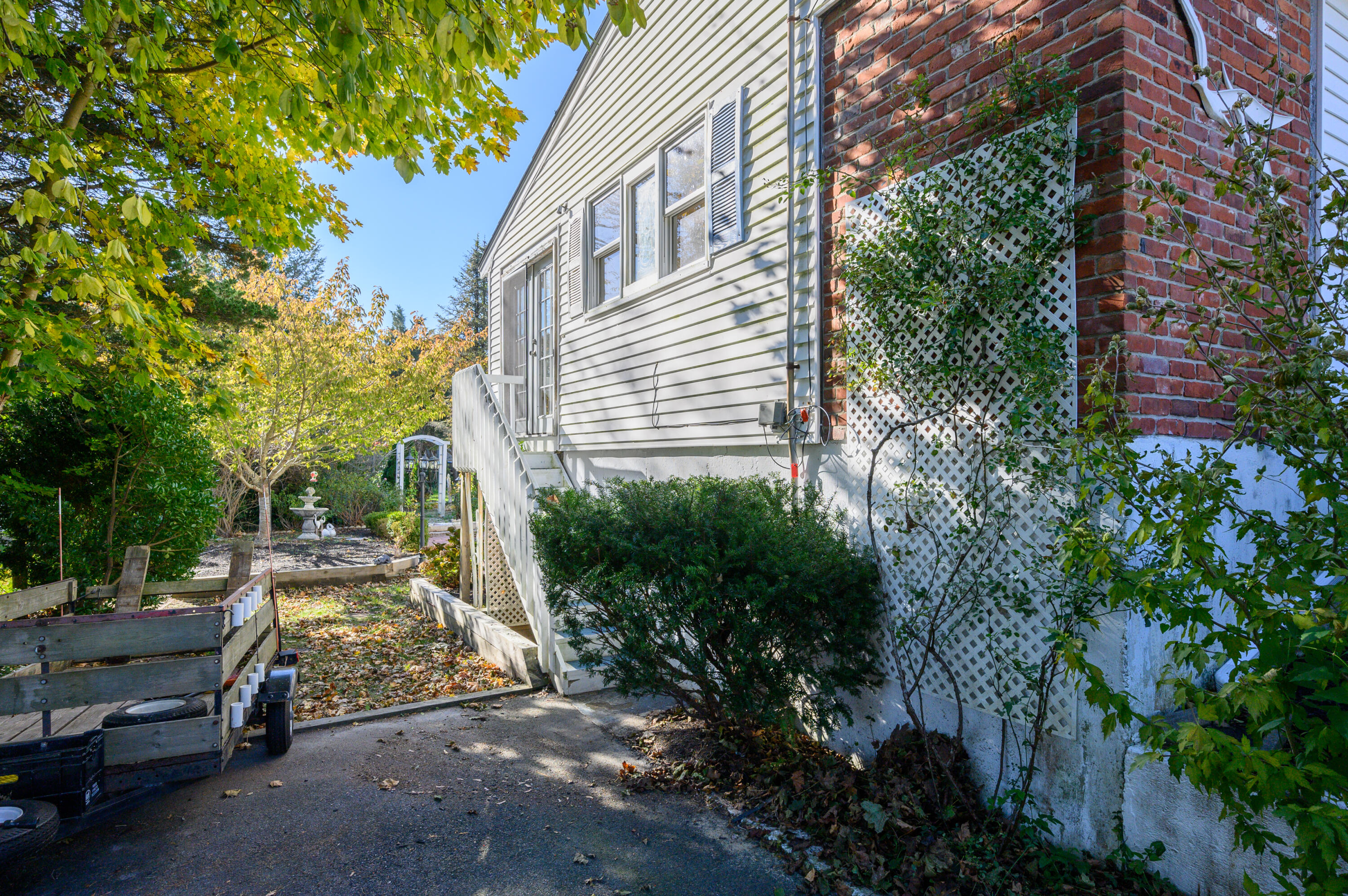 906 Shore Road Pocasset, MA 02559 - Photo 24 of 38 a view of a car park in front of a house
