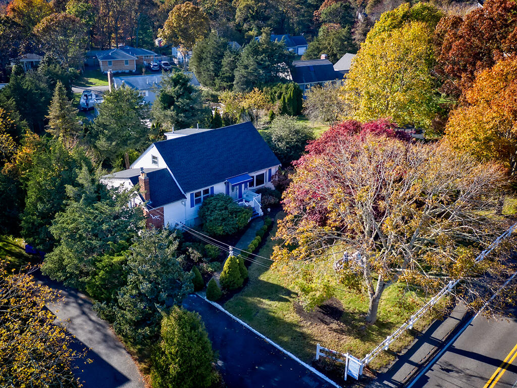 906 Shore Road Pocasset, MA 02559 - Photo 31 of 38 an aerial view of a house with a yard and garden