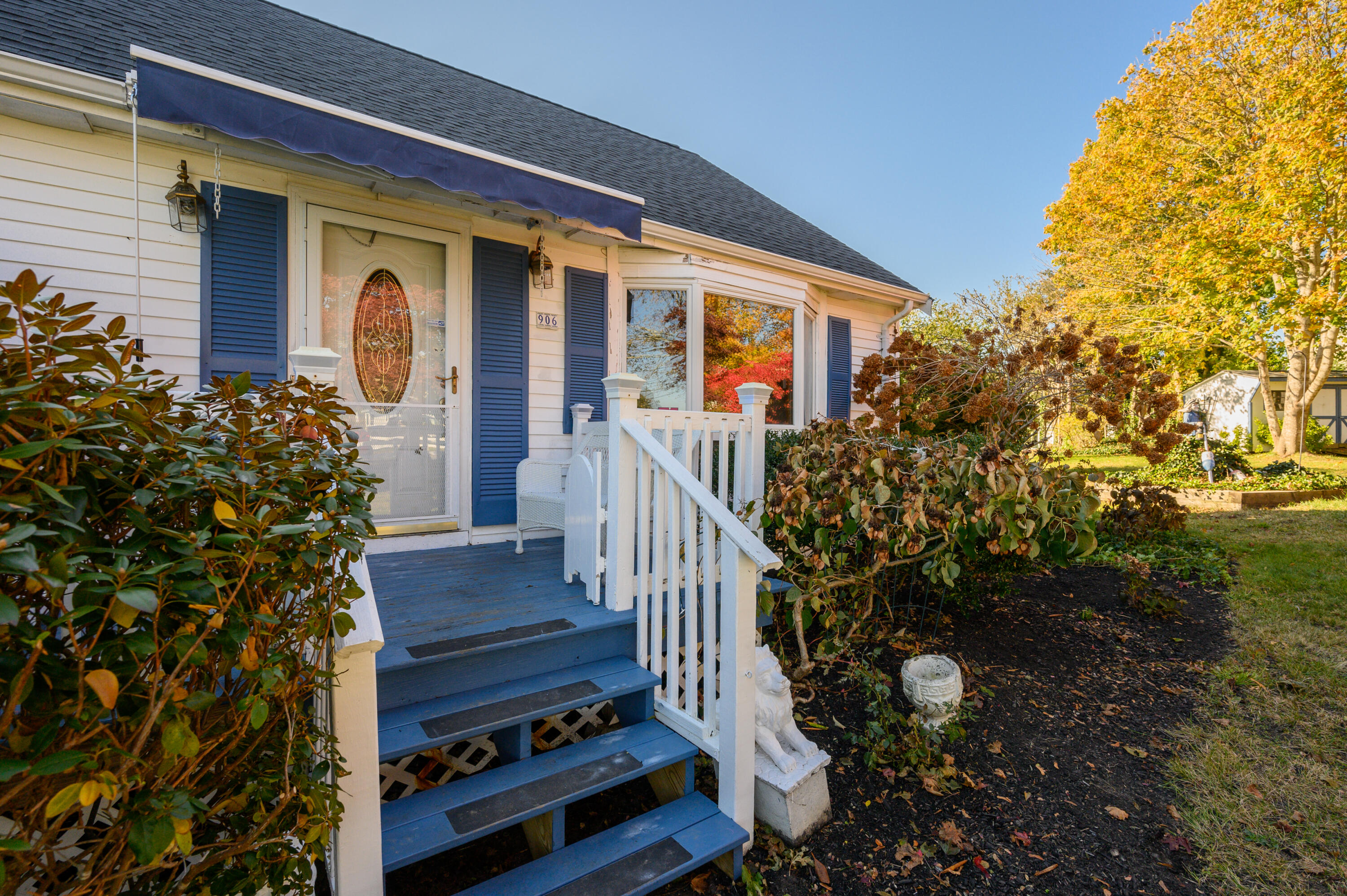 906 Shore Road Pocasset, MA 02559 - Photo 38 of 38 a front view of a house with a yard