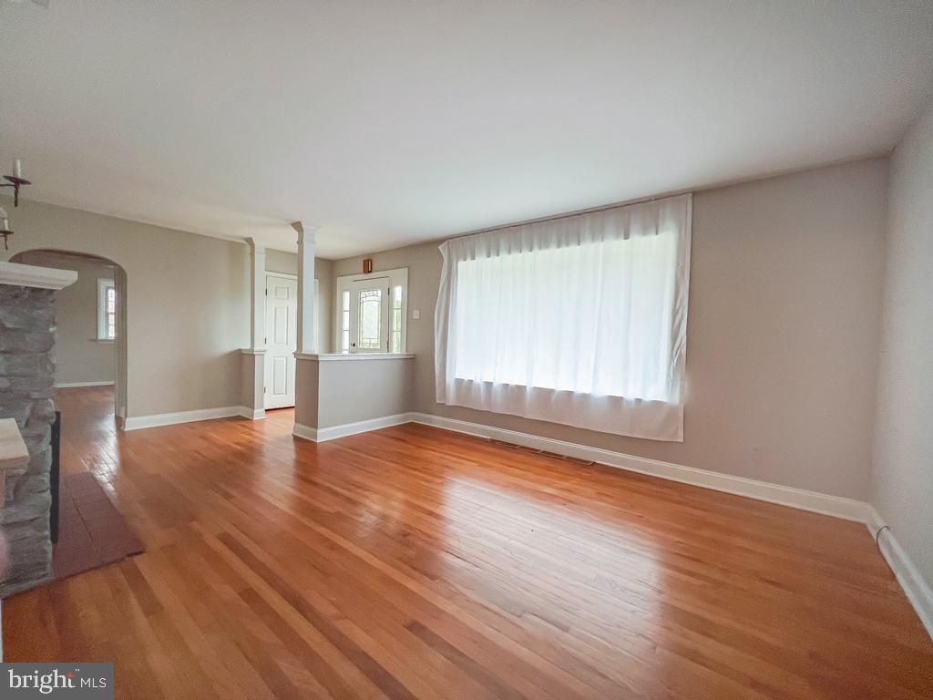 10 Makefield Road Morrisville, PA 19067 - Photo 3 of 46 a view of empty room with wooden floor and fan