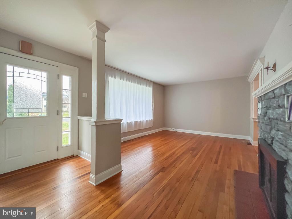 10 Makefield Road Morrisville, PA 19067 - Photo 6 of 46 a view of an empty room with wooden floor and a window