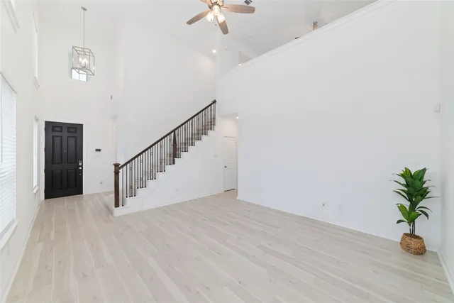 a view of an entryway with wooden floor