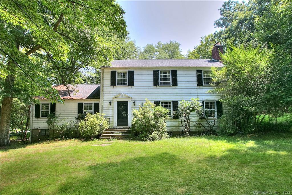 95 Good Hill Road Weston, CT 06883 - Photo 1 of 1 a front view of a house with a garden