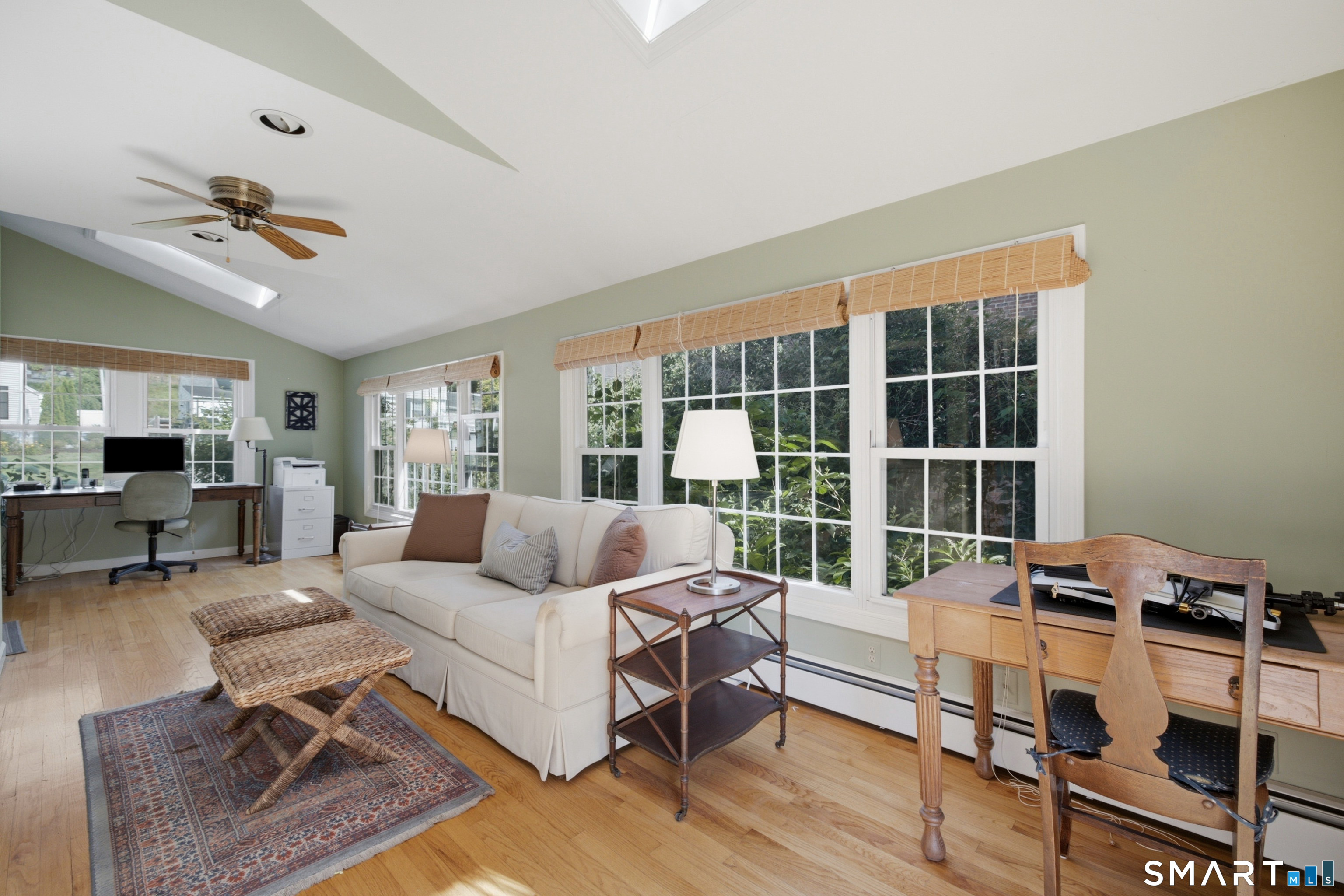 9 Stratford Road West Hartford, CT 06117 - Photo 16 of 40 A special highlight of the home, the sunroom features skylights, gleaming hardwood floors