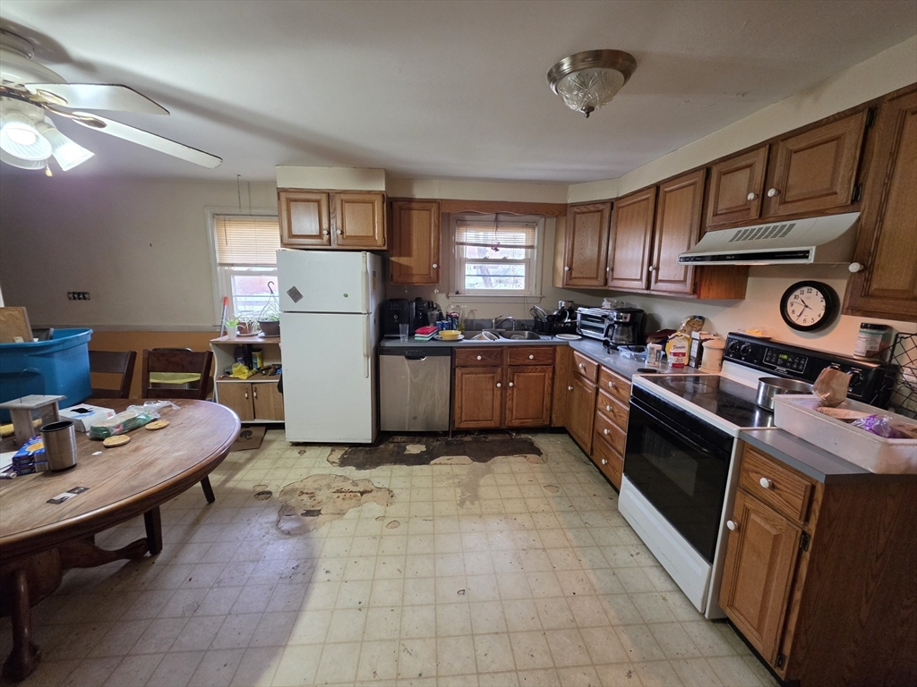 3 Hampton Street Worcester, MA 01604 - Photo 2 of 13 a kitchen with a stove refrigerator and sink