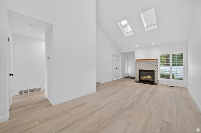 6969 South 855 East Midvale, UT 84047 - Photo 16 of 55 Vaulted ceiling with dual skylights and recessed lighting