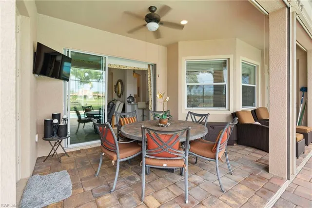 a dining room with furniture and window