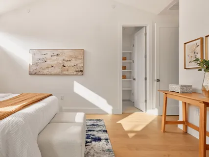 a bathroom with a sink a toilet and a shower