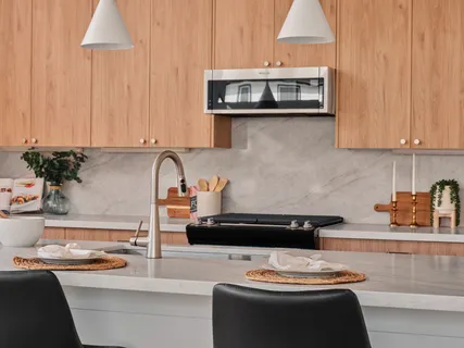 a kitchen with a cabinets and appliances