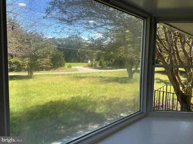 a view of a glass door and porch