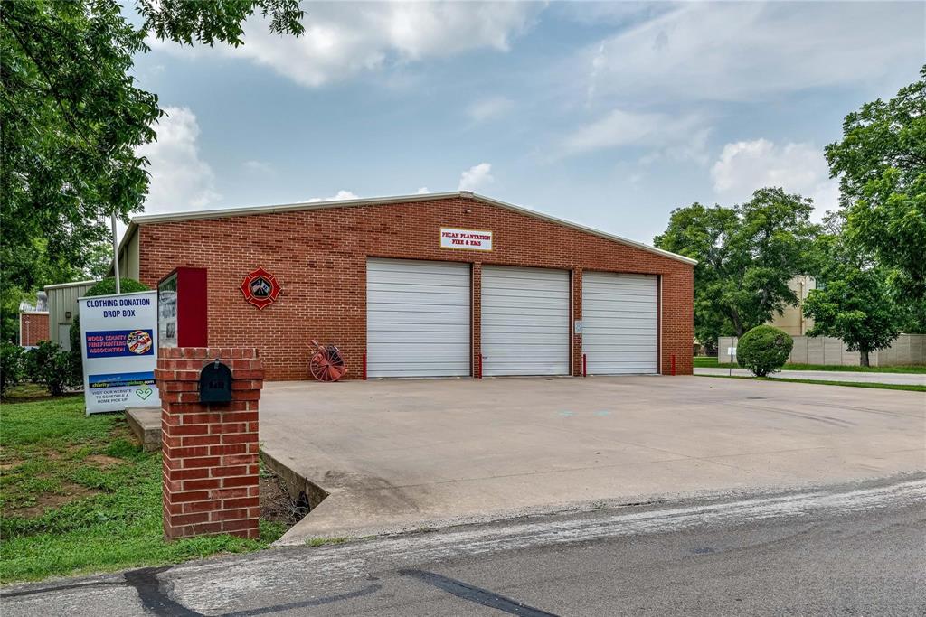 8313 West Landings Road Granbury, TX 76049 - Photo 28 of 33 a front view of a house with garden