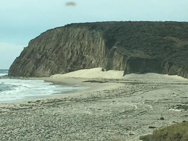 a view of ocean with mountain