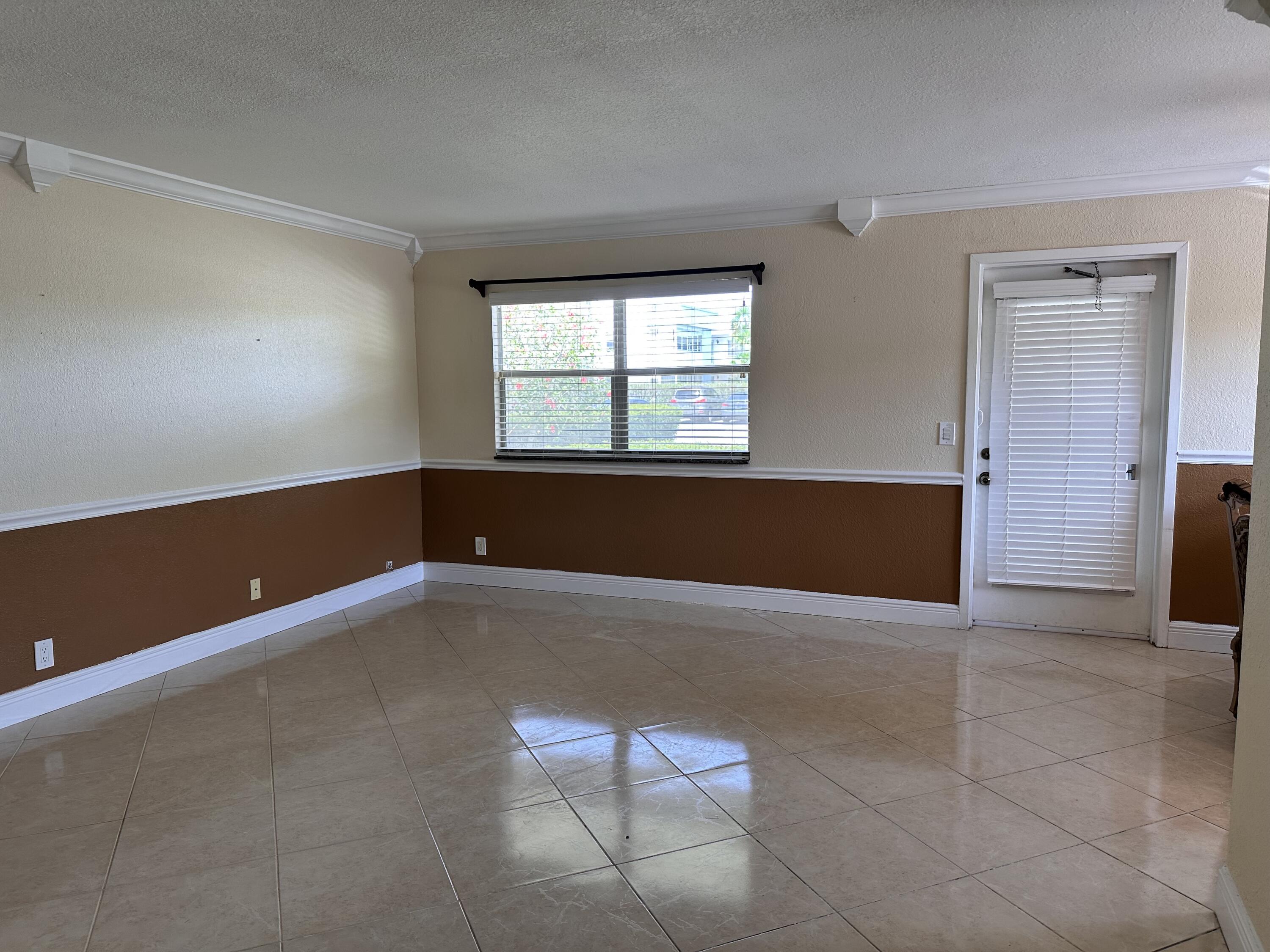 433 Saxony Way Delray Beach, FL 33446 - Photo 15 of 49 an empty room with windows
