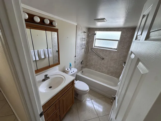 a bathroom with a sink a toilet and a bathtub