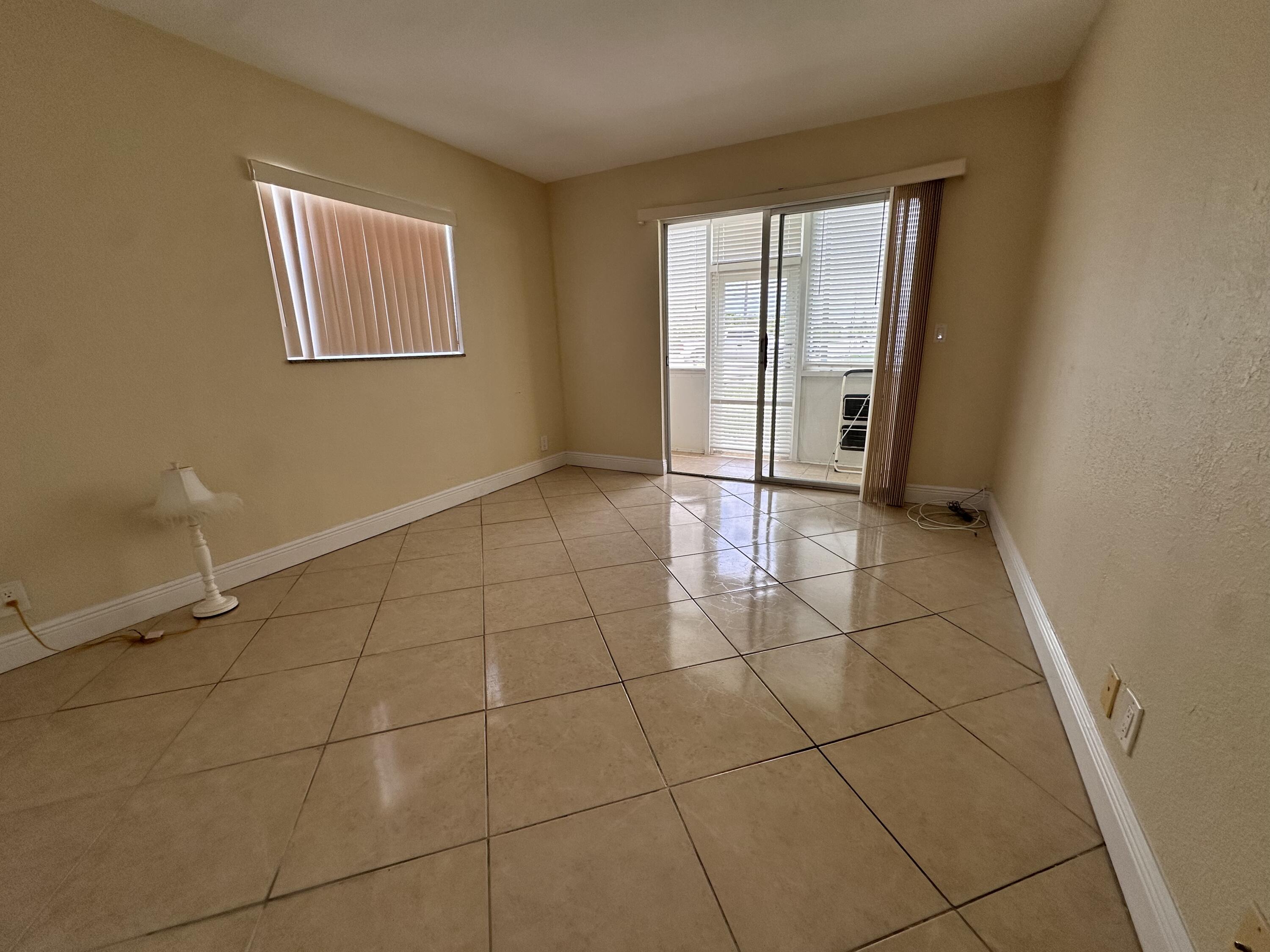 433 Saxony Way Delray Beach, FL 33446 - Photo 20 of 49 a view of an empty room with a window
